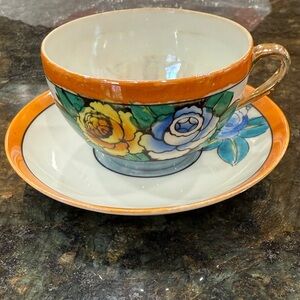 Vintage hand painted teacup and saucer